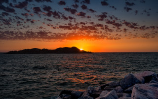 Sunset mountain reflection ocean island - free sunset wallpaper for desktop