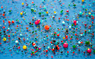 Blue background colored balls confetti - kinetic pointillism free wallpaper for desktop