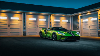 Green sports car night garage - octane free wallpaper