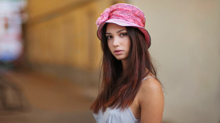 Woman pinkhat whiteshirt building portrait - a pink hat free wallpaper