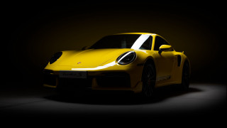 Yellow sports car dark room 33 - a yellow sports car free wallpaper