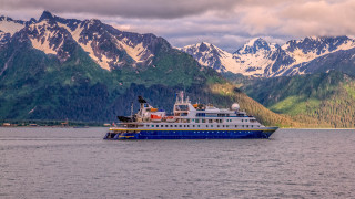 Large boat mountains trees cityscape - color free wallpaper