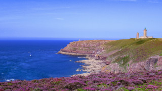 Lighthouse cliff ocean sailboat sunny - a cliff free wallpaper