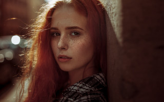 Freckled woman leaning wall serious - freckle free wallpaper