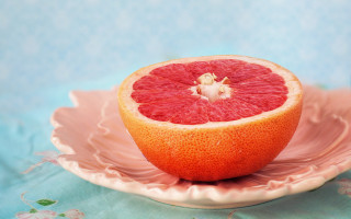 Grapefruit pink plate blue tablecloth - half free wallpaper