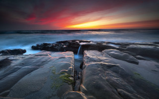 Sunset rocky beach waterfall ocean 3 - a long exposure of a sunset over a rocky beach free wallpaper