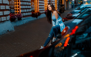 Woman sitting car parkinglot cityscape - parked free wallpaper