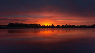 Sunset lake trees clouds horizon - a sunset over a lake free wallpaper