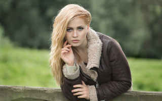 Woman leaning fence serious portrait - andor basch free wallpaper