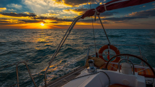 Sunset boat ocean clouds horizon - the sun setting behind free wallpaper for desktop