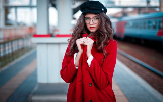 Woman red coat black hat - a train station free wallpaper