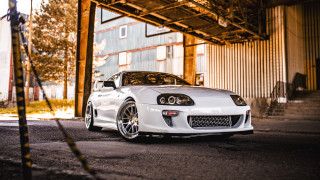 White sports car building metal - a white sports car free wallpaper