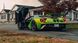 Green sports car open doors - side profile free wallpaper