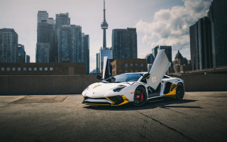 White yellow sports car cityscape - sports car free wallpaper