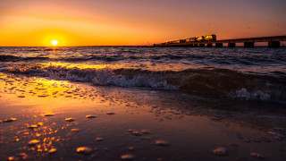 Train bridge ocean sunset waves - a train free wallpaper