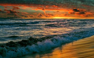 Sunset ocean waves beach surfer - a sunset over the ocean free wallpaper for desktop