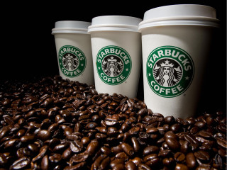 Three starbucks cups coffee beans - top of a pile free wallpaper