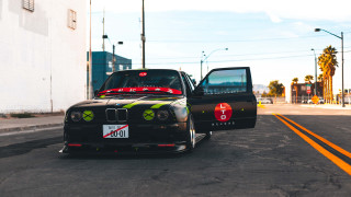 Black car black truck street - leica free wallpaper