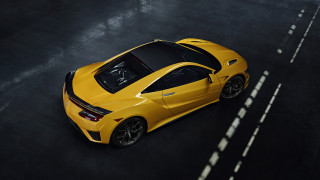 Yellow sports car black floor - white line free wallpaper