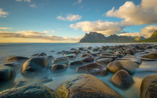 Rocky beach sunset mountains boat - a rocky beach free wallpaper