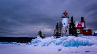 Lighthouse ice snow winter cloudy - a lighthouse free wallpaper