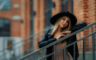 Woman blackhat jacket brickwall portrait - outside free wallpaper for desktop