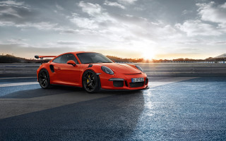 Red porsche sunset clouds mountains - 4k uhd image free wallpaper