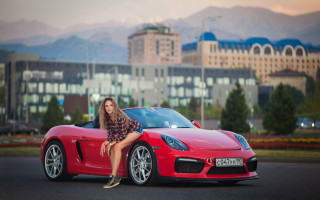 Woman red sports car cityscape 2 - the hood free wallpaper for desktop