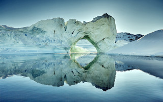 Iceberg reflection mountains blue sky - a large iceberg free wallpaper