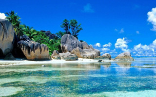 Beach rocks water trees blue - a few white cloud free wallpaper for desktop