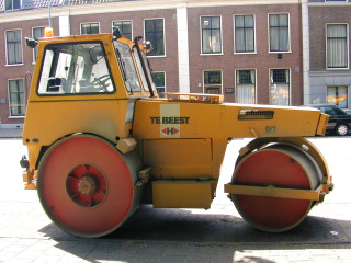 Yellow tractor parked street building - allaert van everdingen free wallpaper