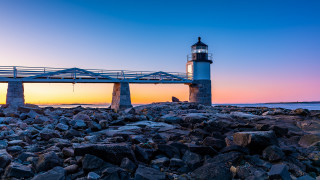 Lighthouse rocky shore bridge sunset 2 - radiant free wallpaper for desktop