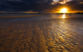 Sunset beach footprints clouds water - footprint free wallpaper