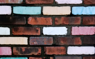 Brick wall multicolored pattern white - saturated free wallpaper