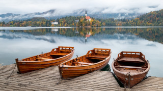 Wooden boats lake church foggy - ferenc joachim free wallpaper