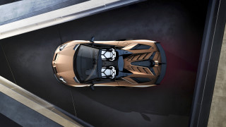 Gold sports car above parking - a black wall free wallpaper for desktop
