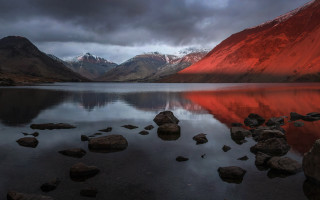 Mountain lake rocks boulders cloudy - red light free wallpaper