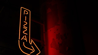 Neon playa building red light - typographic free wallpaper