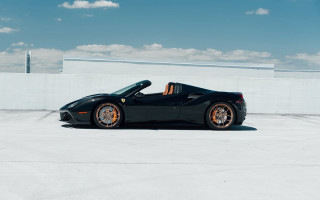 Black sports car sunlit roof - a parking lot free wallpaper