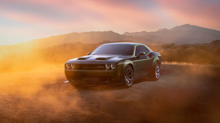 Black car desert mountain sunset - a dirt road in the desert free wallpaper