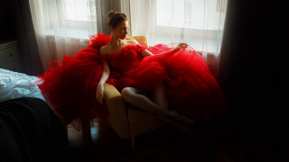 Woman red dress portrait curtains - a window behind her free wallpaper