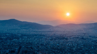 City skyline sunset mountains birdseye - constantine andreou free wallpaper