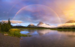 Rainbow over lake mountains sky - over a lake free wallpaper