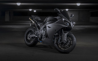 Black motorcycle parking garage white - a white spot free wallpaper