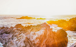 Rocky beach surfboard sunset ocean - a rocky beach free wallpaper