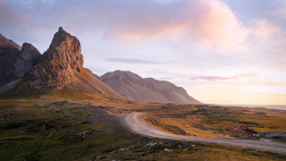 Dirt road grassy field mountain - a grassy field free wallpaper