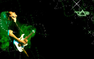 Guitarist darkroom stars green triangle - a man playing free wallpaper for desktop