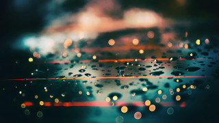 Rainy window water drops bokeh - a close up of a rain free wallpaper