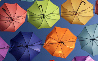 Multicolored umbrellas hanging row sunny - the air together free wallpaper