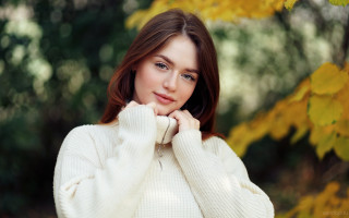 Woman white sweater autumn leaves 2 - a white sweater free wallpaper